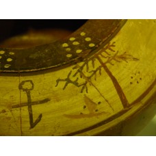 Cross with a circle on top and a tail at the bottom